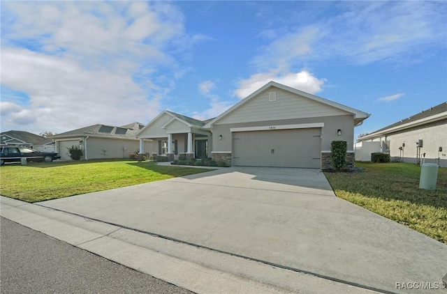 view of front of property featuring a front yard, a garage, and a porch