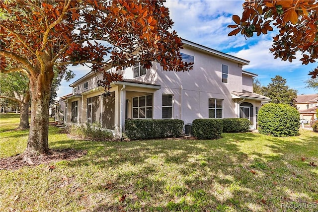 view of property exterior featuring a lawn