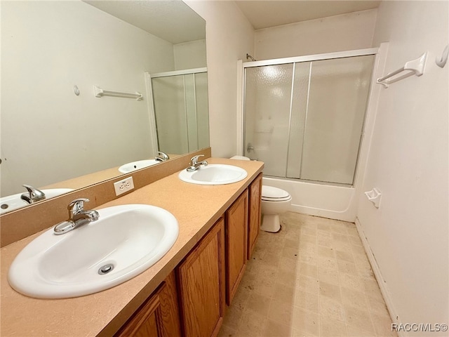 full bathroom featuring vanity, toilet, and enclosed tub / shower combo