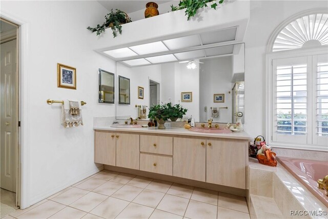 21312 Preservation Drive, Central Pasco, FL 34638 - bathroom featuring double vanity, tile patterned floors, a bathtub, and ceiling fan