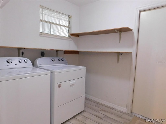 laundry room featuring washing machine and clothes dryer