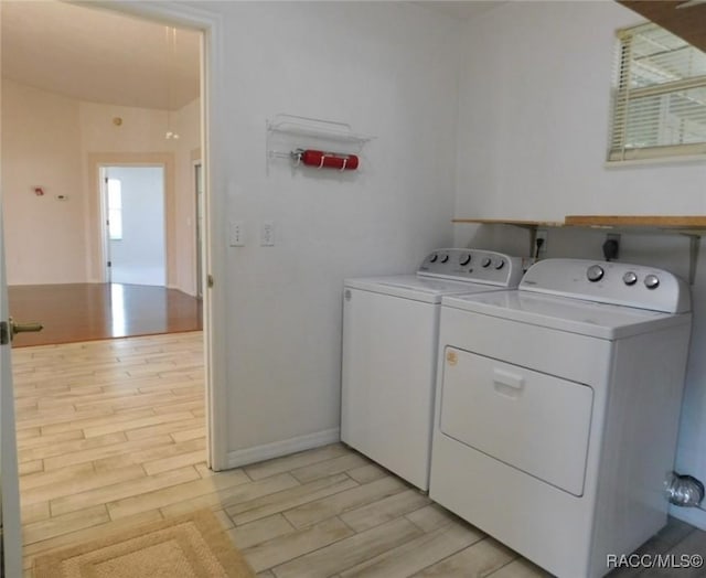 laundry room featuring washing machine and clothes dryer