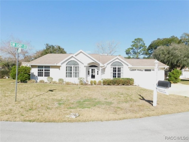 single story home with a front lawn