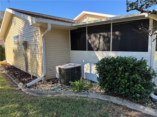 view of side of property featuring central AC