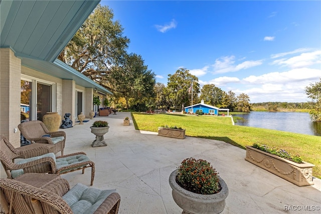 view of patio with a water view