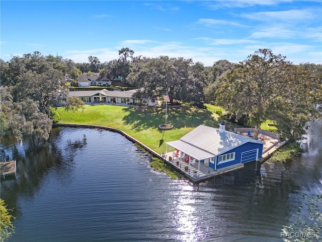 birds eye view of property with a water view