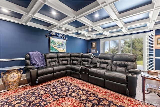 carpeted home theater featuring beamed ceiling and coffered ceiling