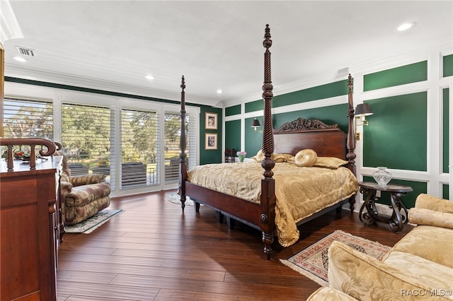 bedroom featuring access to exterior, dark hardwood / wood-style flooring, and crown molding