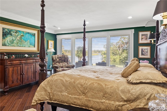 bedroom with dark wood-type flooring and ornamental molding