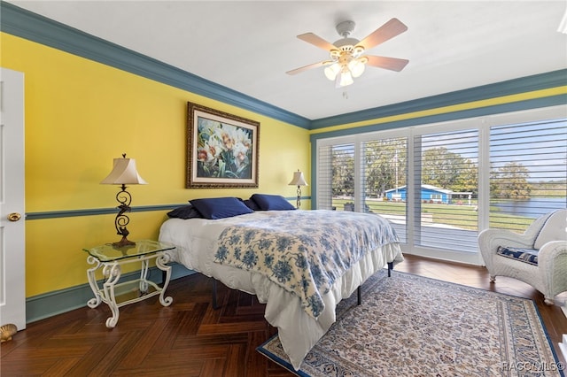 bedroom with access to exterior, dark parquet floors, ceiling fan, and ornamental molding