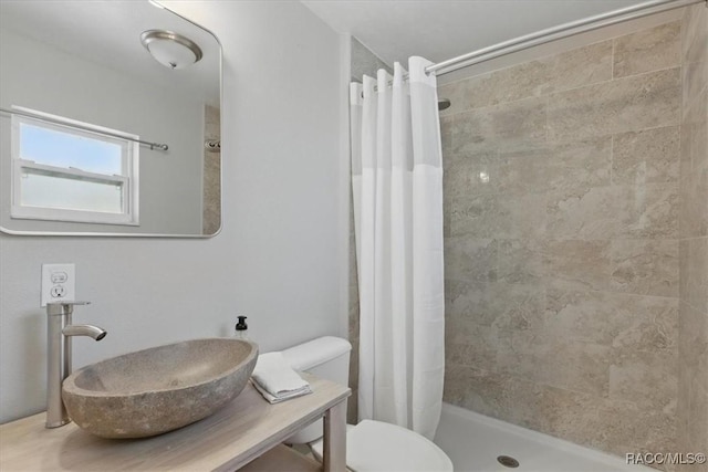 42 Magnolia Ave, Yankeetown, FL 34498 - full bathroom with a sink, a tile shower, and toilet