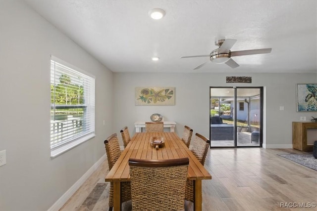 42 Magnolia Ave, Yankeetown, FL 34498 - dining area featuring plenty of natural light, light wood-type flooring, ceiling fan, and baseboards