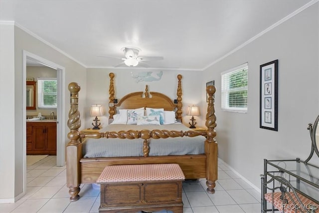 42 Magnolia Ave, Yankeetown, FL 34498 - bedroom featuring ornamental molding, baseboards, light tile patterned floors, ensuite bathroom, and a sink