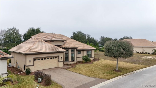 view of front facade featuring a garage and a front lawn