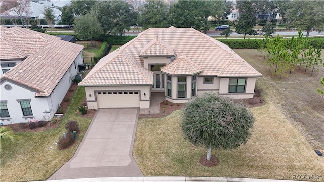 view of front facade with a garage and a front lawn