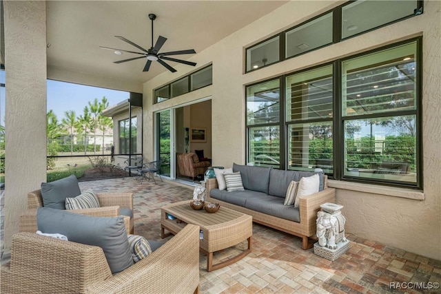 view of patio / terrace with an outdoor living space and ceiling fan