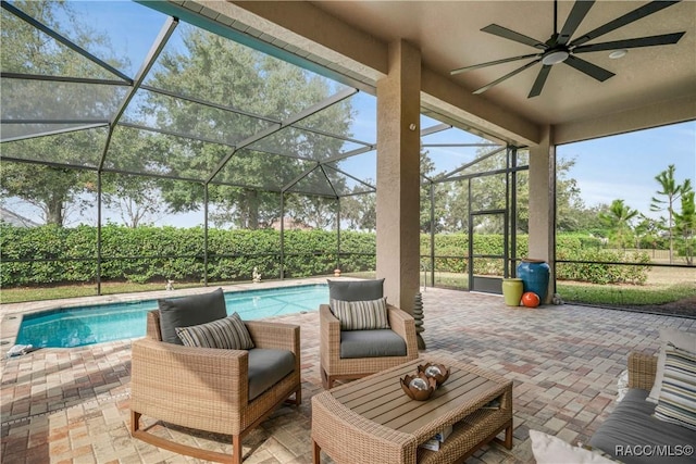 view of patio / terrace featuring a fenced in pool, a lanai, and ceiling fan