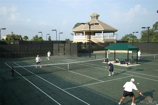 view of tennis court with fence
