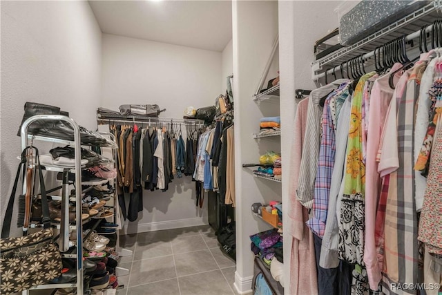 walk in closet featuring light tile patterned floors