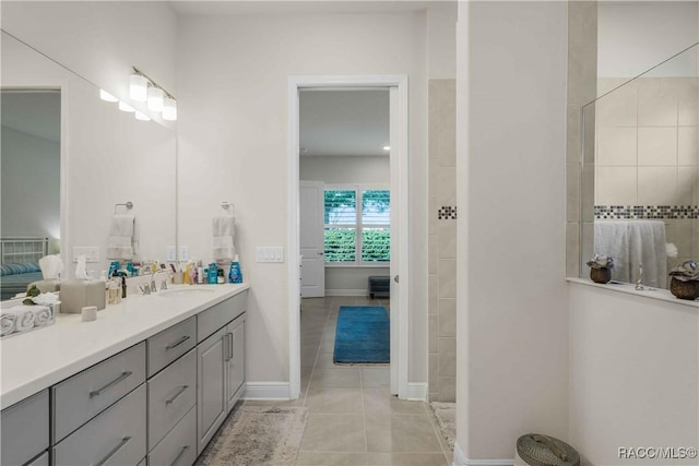 bathroom with tile patterned floors and vanity