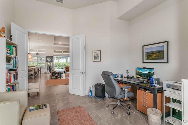 tiled office with a towering ceiling