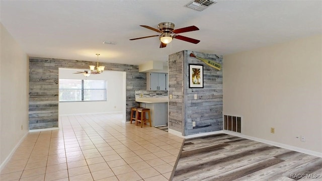 125 W Seymeria Dr, Beverly Hills, FL 34465 - unfurnished living room with a ceiling fan and a chandelier