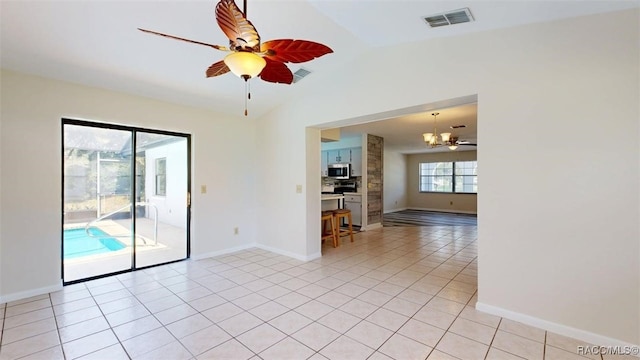 125 W Seymeria Dr, Beverly Hills, FL 34465 - unfurnished room with a chandelier, vaulted ceiling, light tile patterned flooring, and ceiling fan