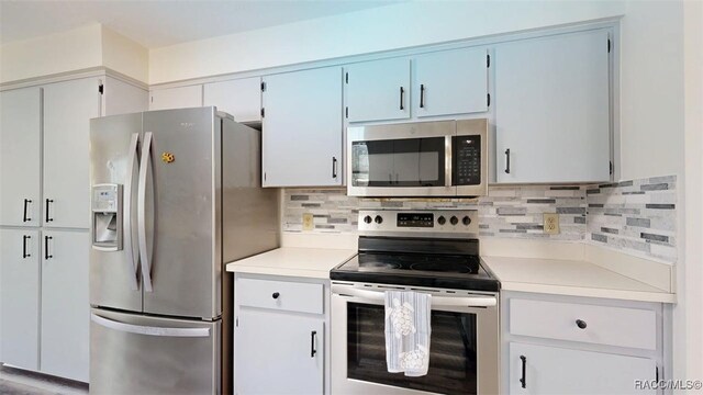 125 W Seymeria Dr, Beverly Hills, FL 34465 - kitchen with stainless steel appliances, light countertops, and tasteful backsplash