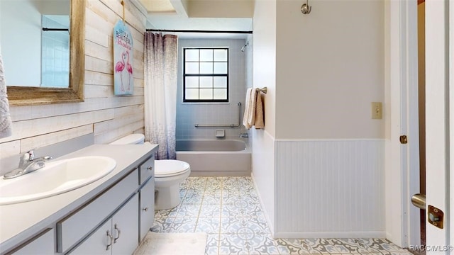 125 W Seymeria Dr, Beverly Hills, FL 34465 - bathroom with vanity, shower / bath combination with curtain, wood walls, and a wainscoted wall