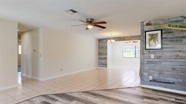 125 W Seymeria Dr, Beverly Hills, FL 34465 - unfurnished room with a ceiling fan, tile patterned flooring, and a chandelier