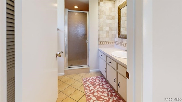 125 W Seymeria Dr, Beverly Hills, FL 34465 - full bathroom with vanity, a stall shower, tile patterned floors, and tasteful backsplash