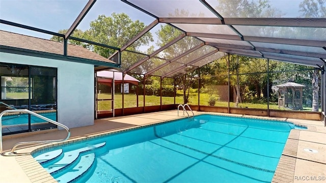 125 W Seymeria Dr, Beverly Hills, FL 34465 - swimming pool featuring a patio and glass enclosure