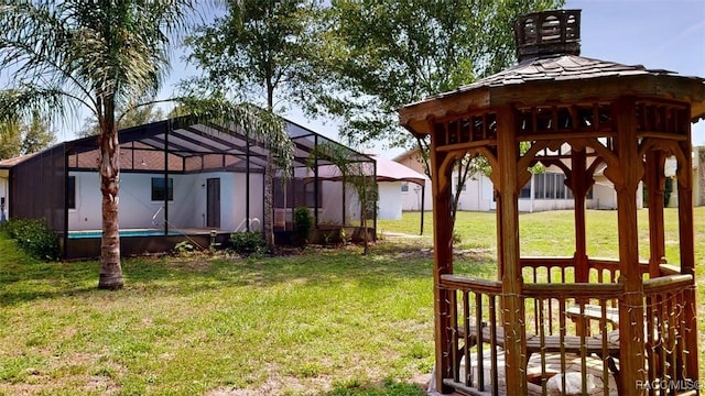 125 W Seymeria Dr, Beverly Hills, FL 34465 - view of green lawn featuring a lanai, a gazebo, and an outdoor pool