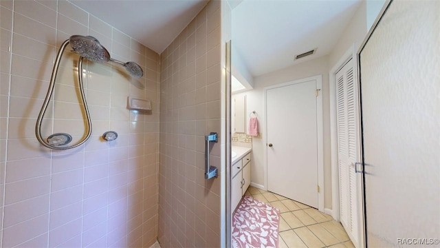 125 W Seymeria Dr, Beverly Hills, FL 34465 - full bathroom with a closet, vanity, tile patterned flooring, and a tile shower