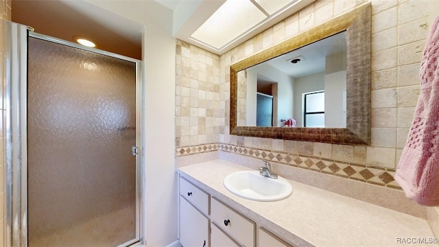 125 W Seymeria Dr, Beverly Hills, FL 34465 - full bath featuring vanity, backsplash, a shower stall, and tile walls
