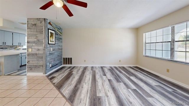 125 W Seymeria Dr, Beverly Hills, FL 34465 - unfurnished living room with a ceiling fan and light wood-type flooring