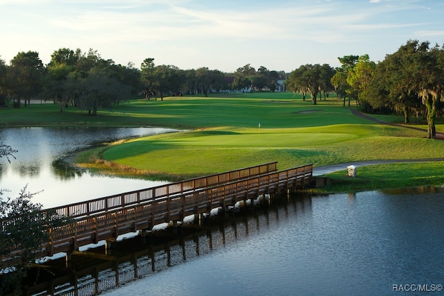 surrounding community with a water view