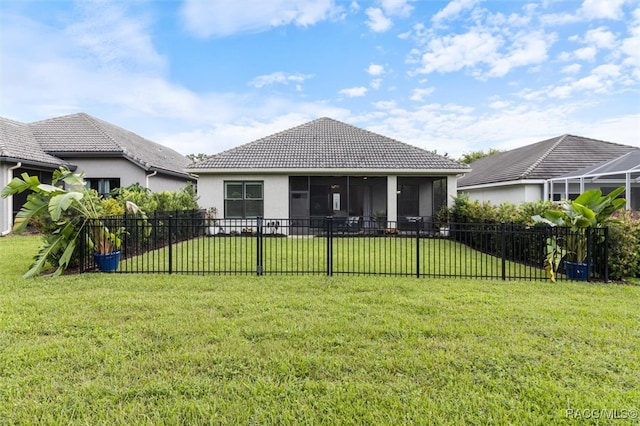 view of front facade featuring a front lawn and a sunroom