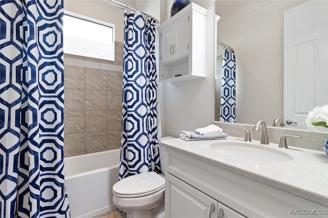 full bathroom with vanity, toilet, and shower / bath combo with shower curtain