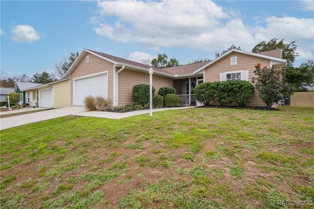 ranch-style home featuring a front lawn and a garage