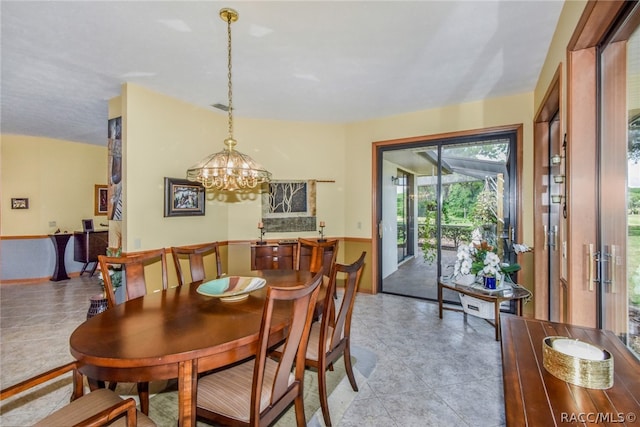 dining area with a chandelier