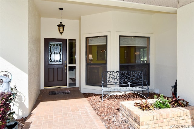 property entrance featuring a porch