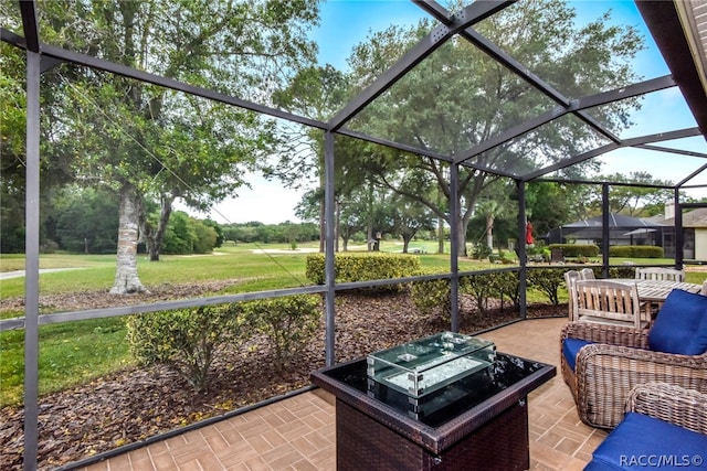 view of patio featuring a lanai