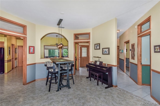 dining room featuring tile patterned floors and a notable chandelier