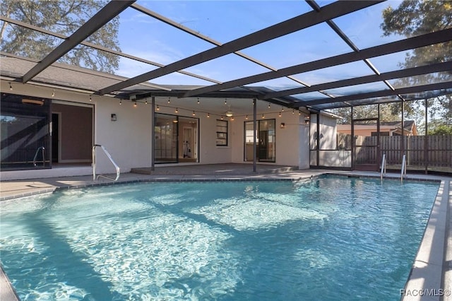 view of pool with a lanai and a patio area