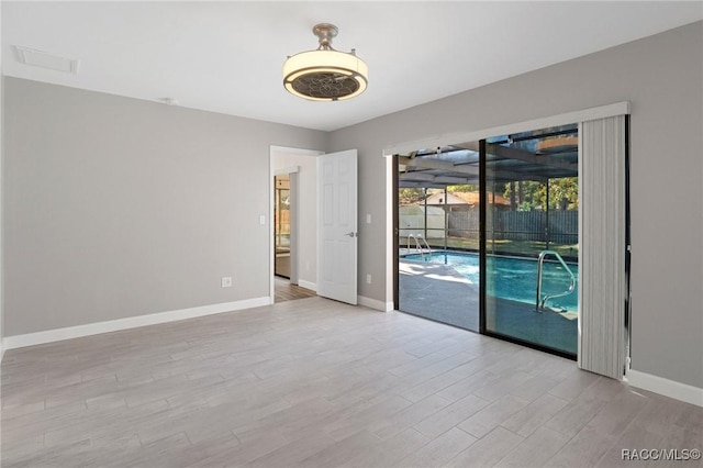 unfurnished room featuring light wood-type flooring