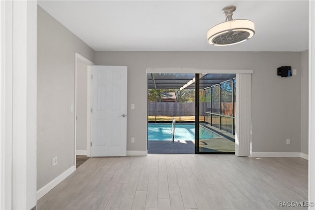 spare room featuring light wood-type flooring