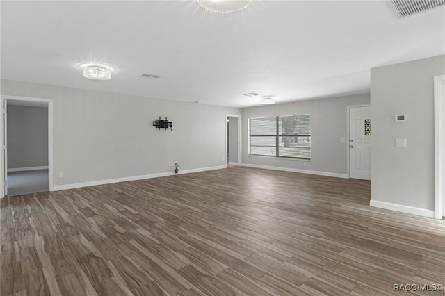 empty room featuring wood-type flooring