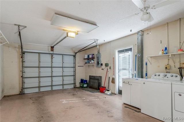 garage featuring electric panel, ceiling fan, washer and clothes dryer, and a garage door opener