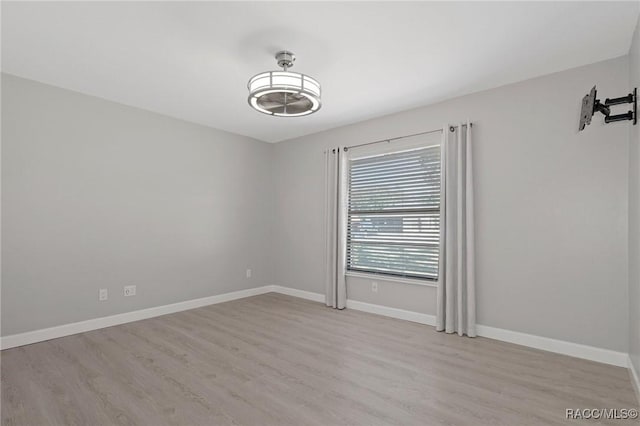 empty room with light hardwood / wood-style floors